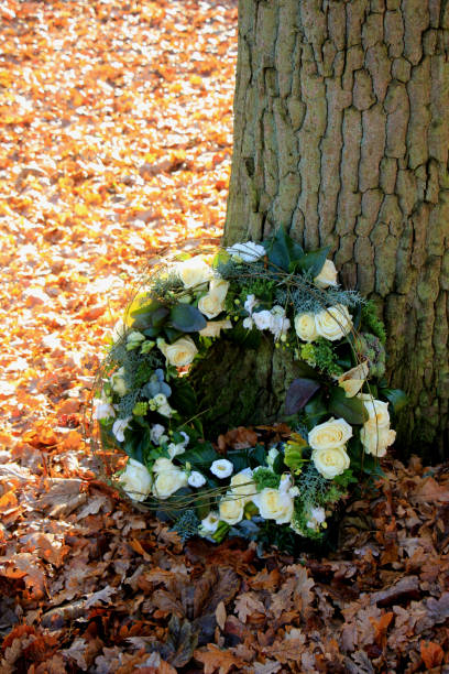 istock Sympathy wreath near a tree 642849180