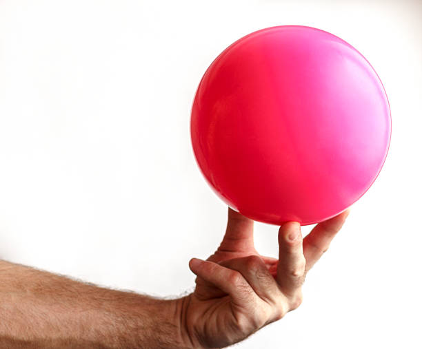 istock Man's hand holding a ball for gymnastics 642853102