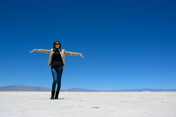 Woman show the  Salinas Grandes (Argentina)
