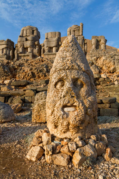 Adiyaman, Turkey - October 28, 2014: Statues on top of the Mount Nemrut known also as Nemrut Dagh at the sunrise, in Adiyaman, Turkey. Statues were built in the 1st century BC, by the King Antiochus of Commagene. Statues on the Nemrut Mountain built in the 1st century BC, by the King Antiochus of Commagene. nemrut dagi stock pictures, royalty-free photos & images