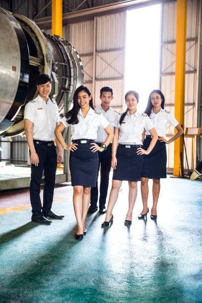 istock Aviation University students posing in Airplane hangar 642862178