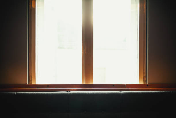 Interior details, view on window and part of furniture, during day.