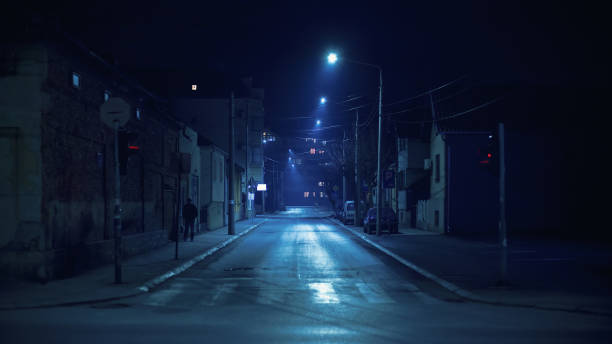 Small Balkan Town Street Cacak town in Serbia, winter season, small Balkan city outdoors during night. dark street stock pictures, royalty-free photos & images