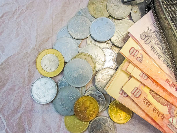istock Currency,Coins scattering from the wallet. 642879106