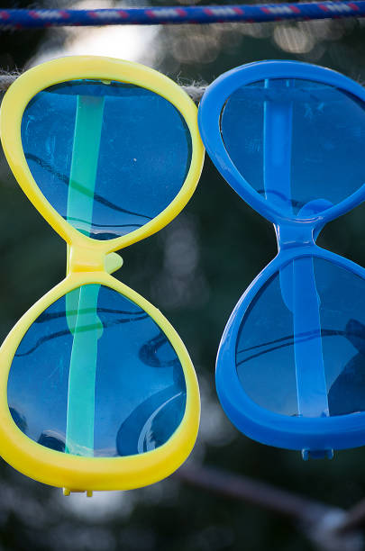 istock Big sunglasses yellow and blue outdoors sold 642879318