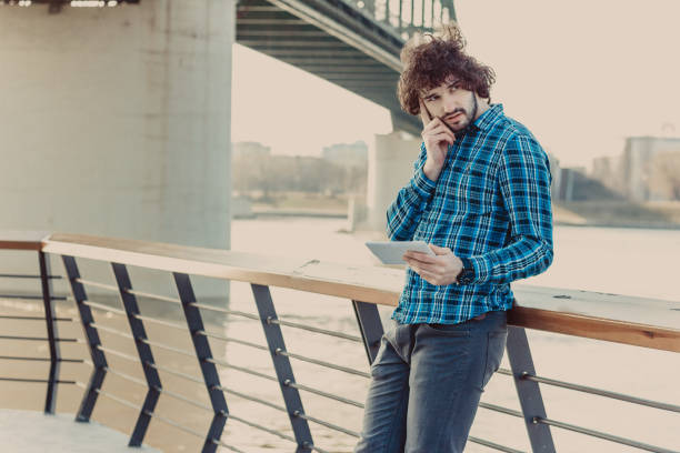 istock Photo of a handsome businessman using tablet 642882432