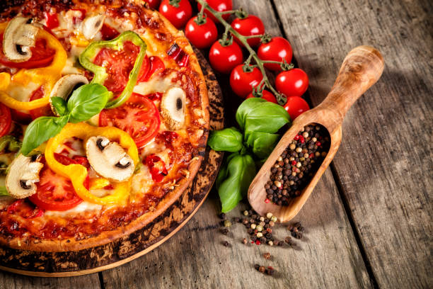 istock Pizza with ingredients served on wood 642882546