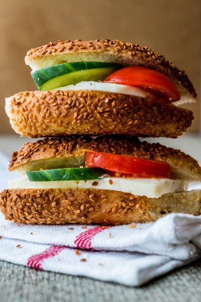 istock Turkish Bagel Simit Sandwich with cheese, tomato and cucumber. 642902082