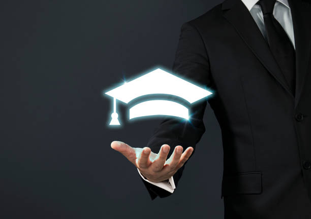 Hand holding graduation cap. concept for education and scholarship, student loan, study financial, save money for a degree, saving for education