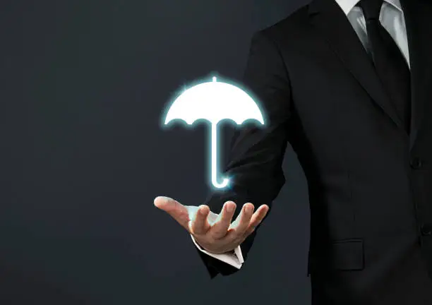 Photo of Businessman magical touch concept - umbrella