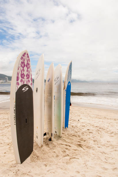 Surfboards standing upright in bright sun on the Copacabana Beach - Rio De Janeiro - Brazil - December 19th, 2013