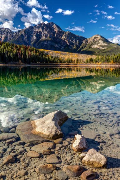 istock Autumn reflection of Pyramid Mountain 642911054
