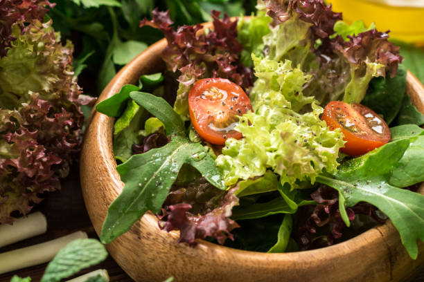 istock Fresh ready to eat salad with olive oil 642920558