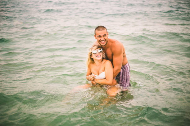 istock happy couple on the beach 642932692