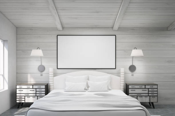 istock Double bed in a wooden room with poster 642933684