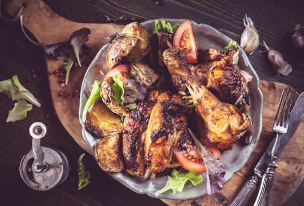 istock Slices of grilled chicken on plate rustic above 642936660