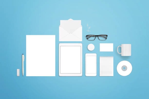 istock Collection of stationery items to create great presentations for your branding projects. Top view of blue desk. 642936820