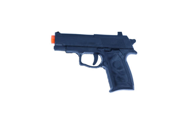 istock toy  black gun plastic for children on white background 642937168