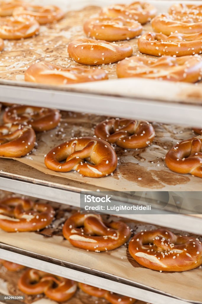 Cooked pretzel on a rack Cooked pretzel on a rack ready to be sold Baked Stock Photo