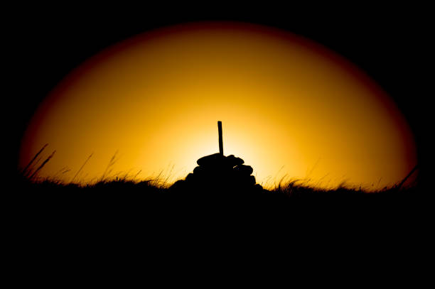 istock Silhouette of rocks at sunrise in circle 642943426