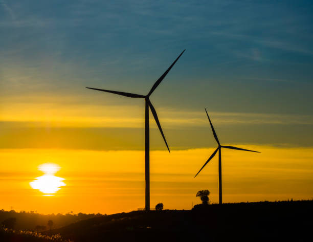 istock Wind turbine power generator at twilight 642946252