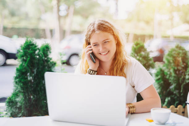 istock Plus size model girl taking on phone in cafe 642946590