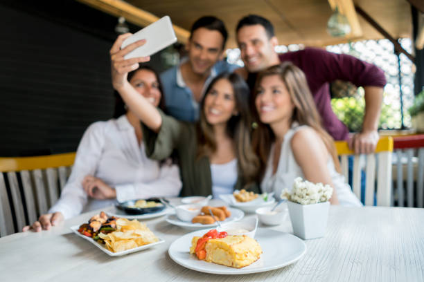 istock Friends taking a selfie at a restaurant 642958608