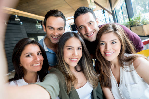 istock Friends taking a selfie at a restaurant 642958688