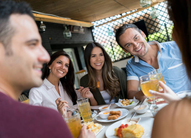 istock Friends eating together at a restaurant 642958702