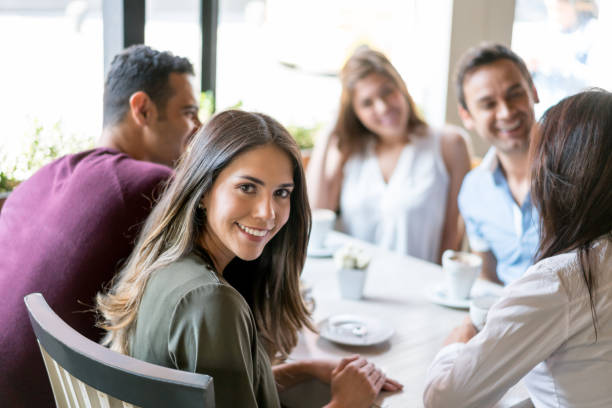 istock Happy woman having dinner with friends 642958710