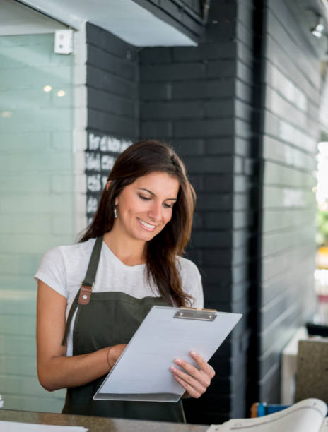 istock Happy business owner working at a restaurant 642958714