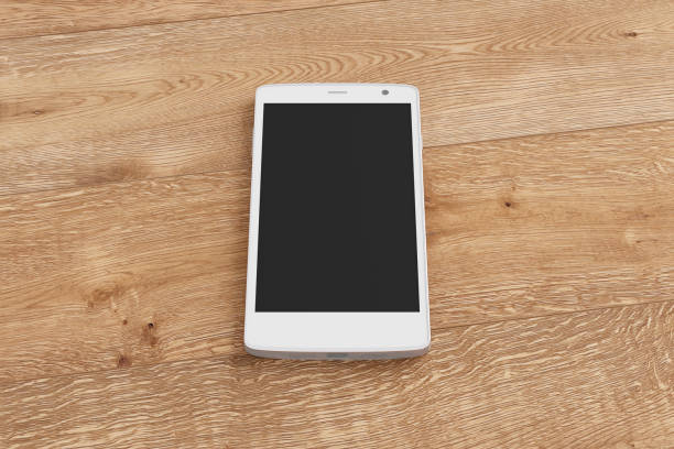 istock Smartphone on wooden background. 642961756