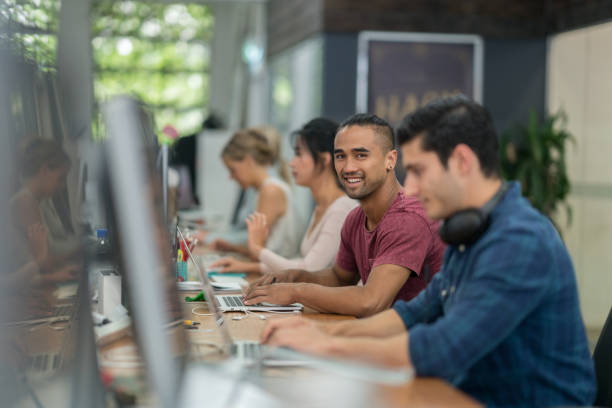 istock People working online at the office 642961938