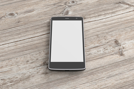 Black smartphone with white blank screen on wooden background. Isolated with clipping path around smartphone and around screen copy space. 3d render