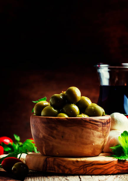 istock Green olives, cheese, tomatoes and wine 642974246