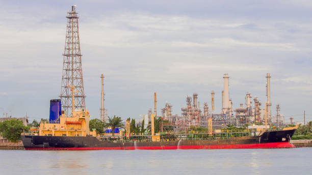 istock Oil refinery river front with transport ship 642974258
