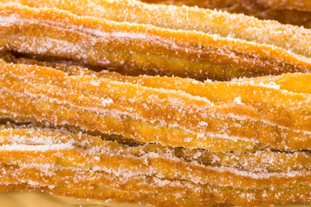 istock Bunch of curros covered with granulated sugar 642978170
