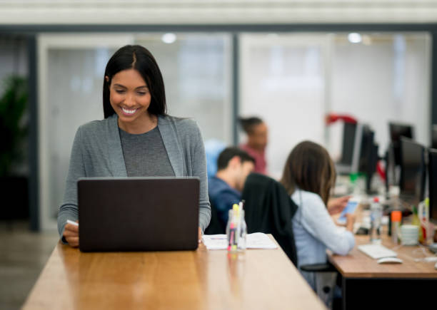 istock Happy woman working online at the office 642980984