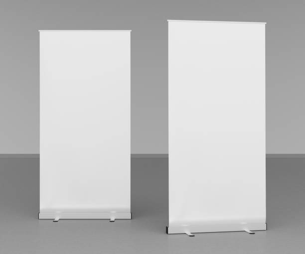 istock Blank roll up banner stands on gray floor 642984728