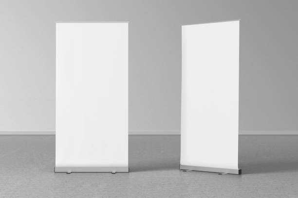 istock Blank roll up banner stands on gray floor 642984760