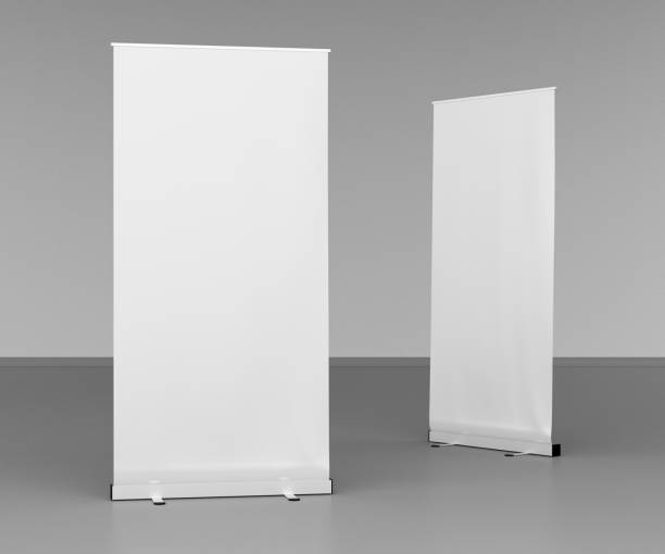 istock Blank roll up banner stands on gray floor 642984788