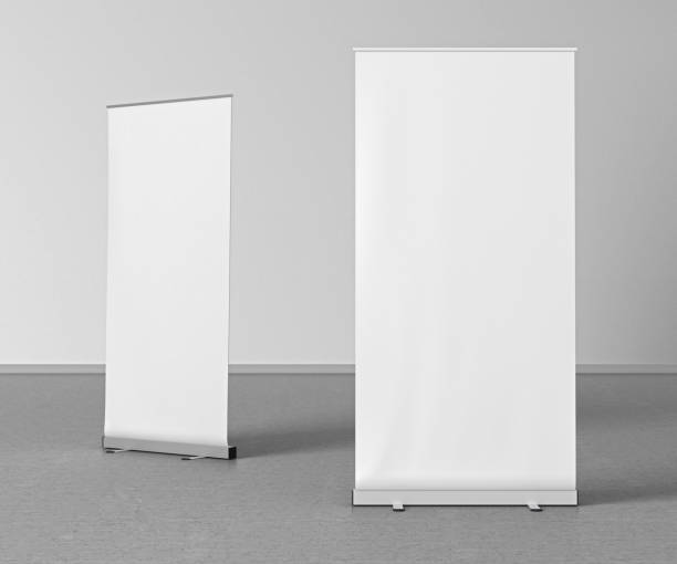 istock Blank roll up banner stands on gray floor 642986812