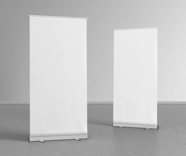 istock Blank roll up banner stands on gray floor 642986844
