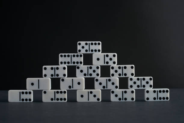 istock Tower of white domino play pieces 642990476
