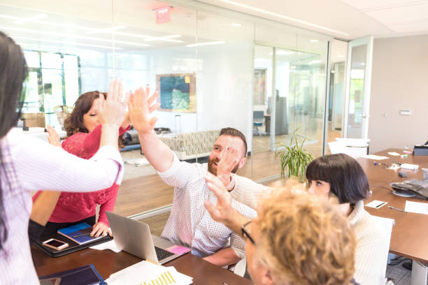 istock Coworkers Celebrating with a High-Five 642991106
