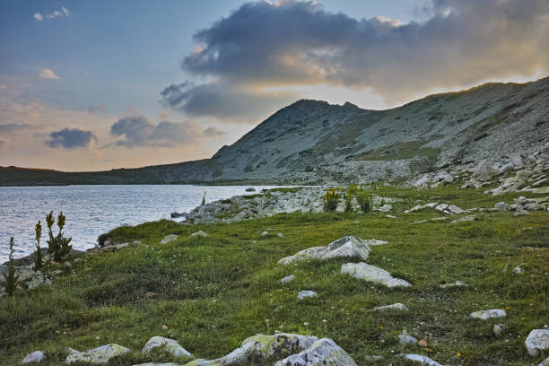 istock Yellow Sunset over Tevno Lake, Pirin mountain 642998454