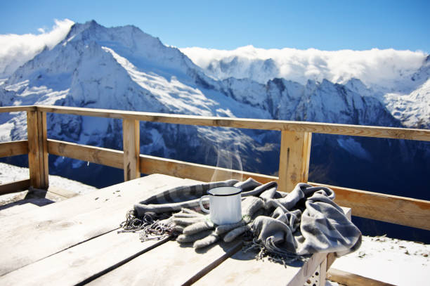Hot tea in winter mountains stock photo