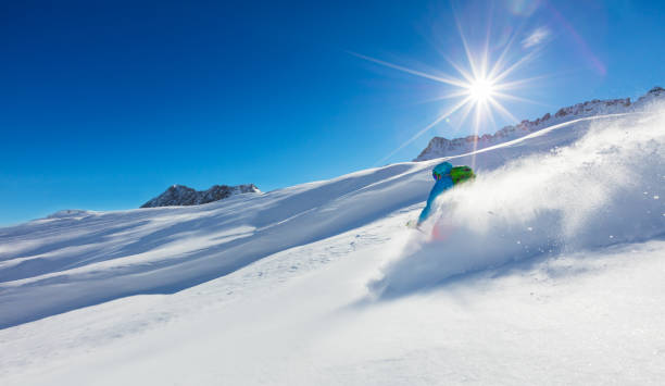 istock Freerider skier running downhill 643018674