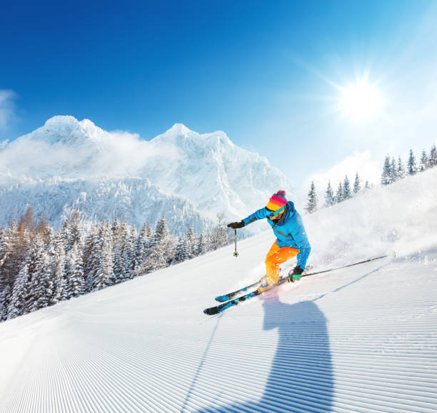 istock Skier on piste running downhill 643020792