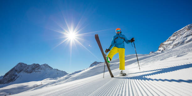 istock Skier on piste in sunny day. Skiing concept. 643021144